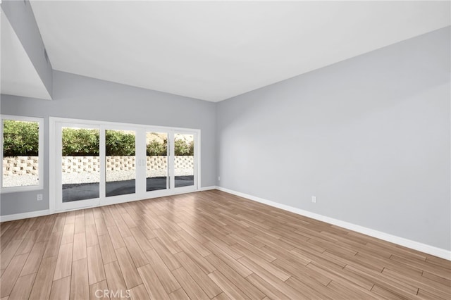 unfurnished room with light hardwood / wood-style flooring