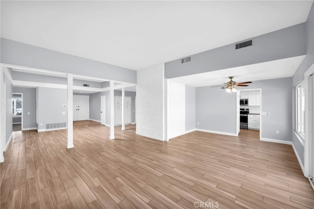 unfurnished living room featuring light hardwood / wood-style floors and ceiling fan