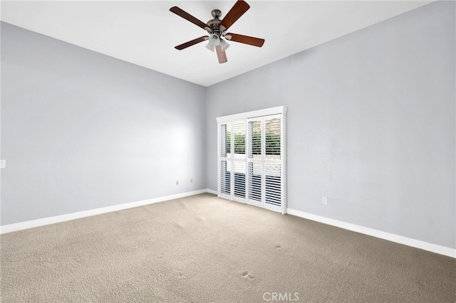 empty room with carpet and ceiling fan