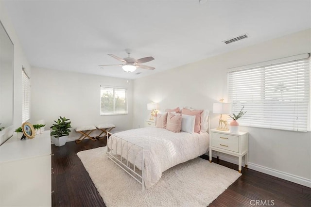 bedroom featuring ceiling fan and dark hardwood / wood-style flooring