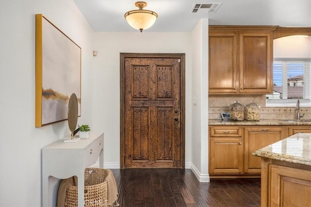 interior space featuring dark hardwood / wood-style flooring and sink