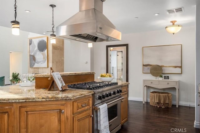 kitchen featuring island exhaust hood, light stone counters, decorative light fixtures, high end stainless steel range, and dark hardwood / wood-style floors