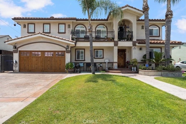 mediterranean / spanish home featuring a balcony, a garage, and a front lawn