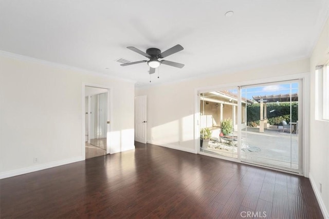 spare room with ceiling fan, crown molding, and dark hardwood / wood-style floors