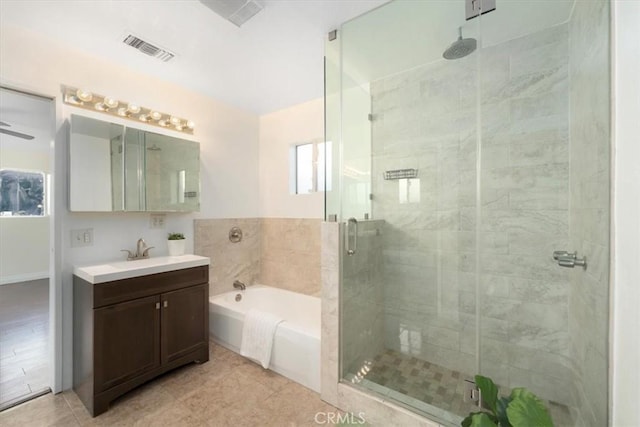 bathroom with ceiling fan, tile patterned flooring, vanity, and shower with separate bathtub