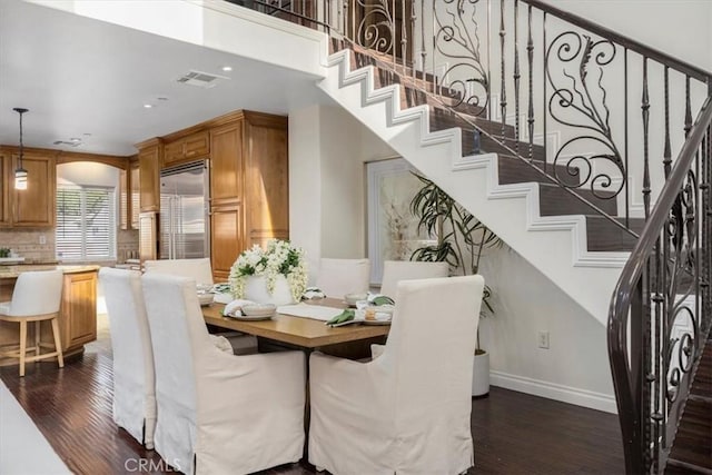 dining room with dark hardwood / wood-style floors