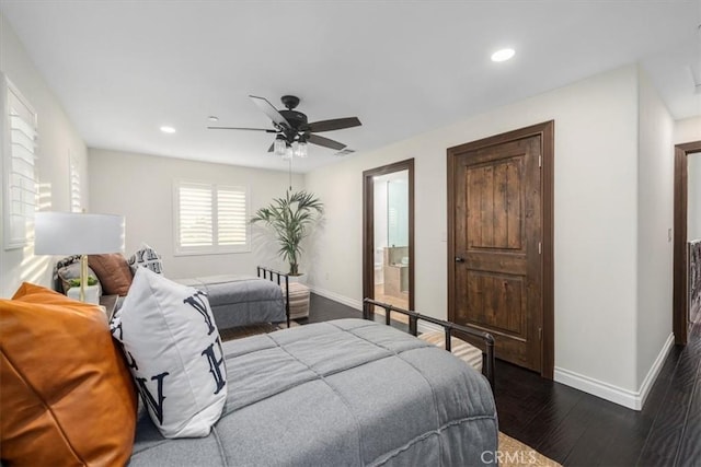 bedroom featuring ceiling fan, dark hardwood / wood-style floors, and ensuite bath