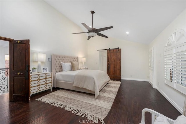 bedroom featuring a barn door, hardwood / wood-style flooring, high vaulted ceiling, and ceiling fan