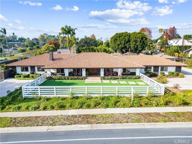 ranch-style house with a front lawn