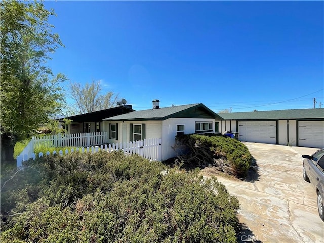 single story home featuring a garage