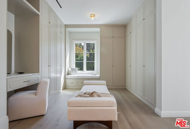 sitting room with light hardwood / wood-style flooring