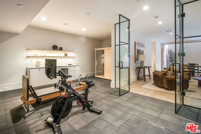 workout area featuring hardwood / wood-style flooring