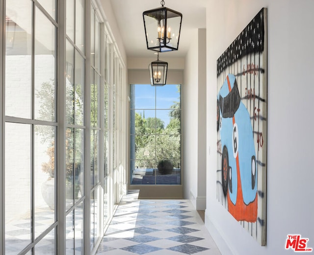 entryway with an inviting chandelier