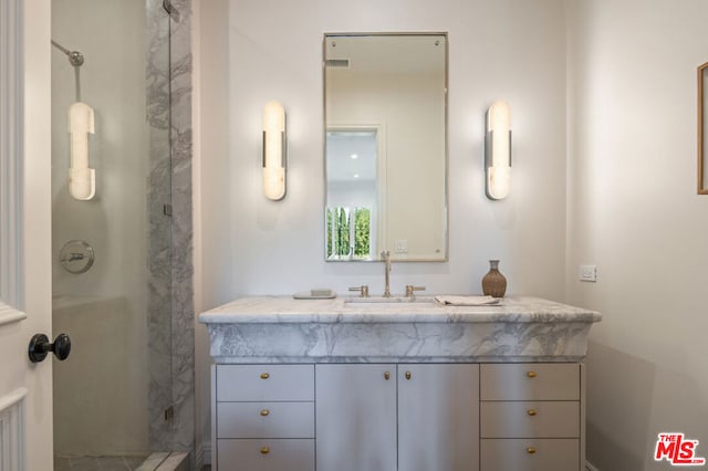 bathroom featuring vanity and walk in shower