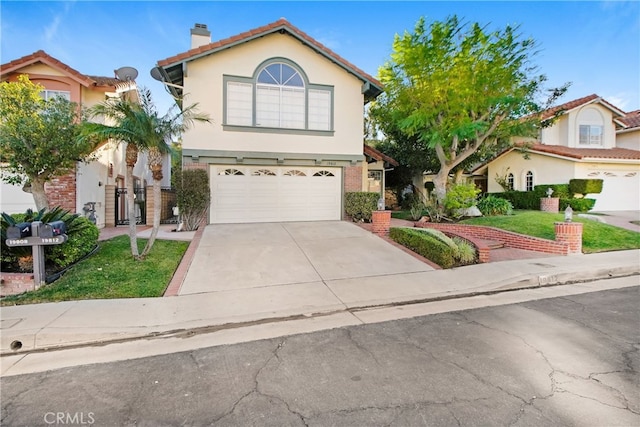 front facade featuring a front yard and a garage