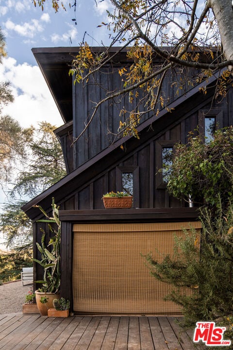 view of side of home with a deck