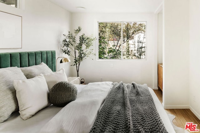 bedroom featuring hardwood / wood-style flooring