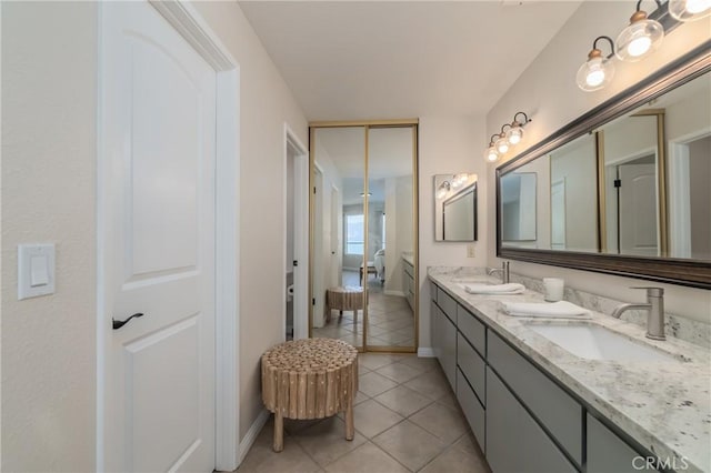 bathroom with tile patterned flooring and vanity