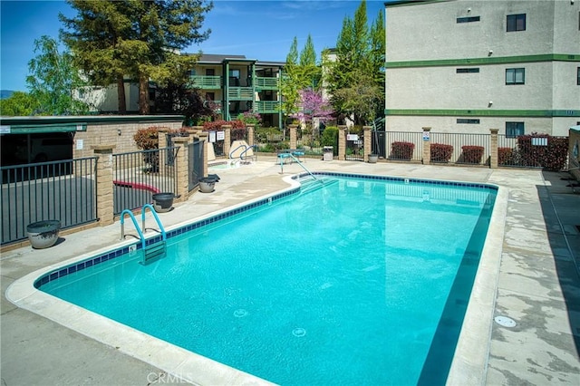 view of pool featuring a patio area