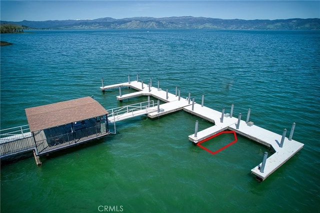 dock area with a water and mountain view