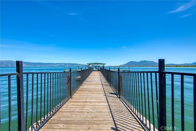 dock area featuring a water and mountain view