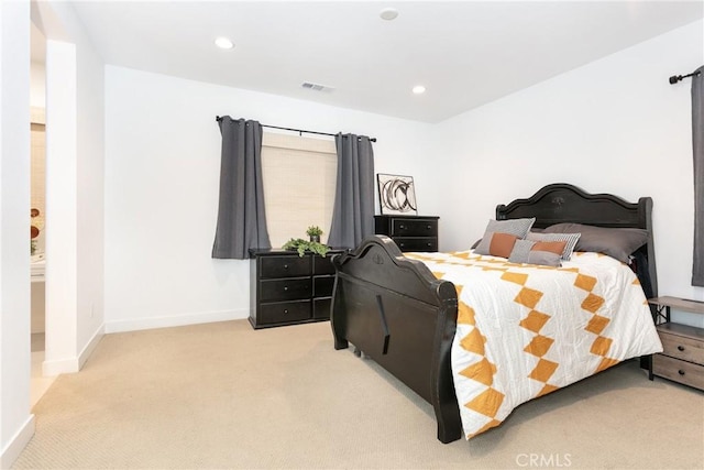 bedroom featuring light colored carpet