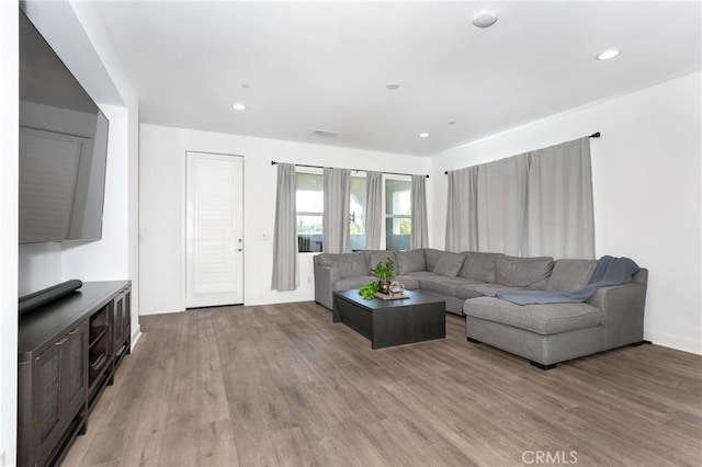 living room with light hardwood / wood-style flooring