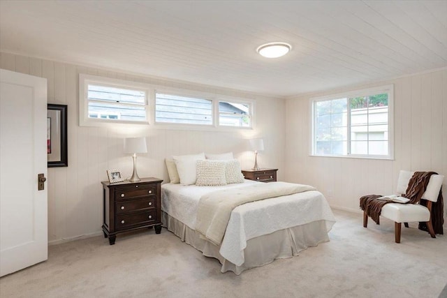 bedroom featuring light carpet