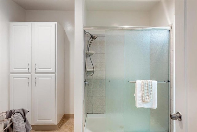 bathroom featuring an enclosed shower