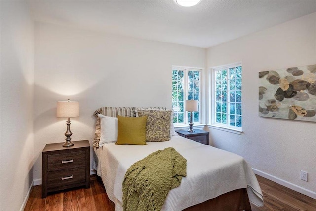 bedroom featuring dark wood-type flooring