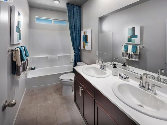 full bathroom featuring shower / bathing tub combination, tile patterned flooring, vanity, and toilet