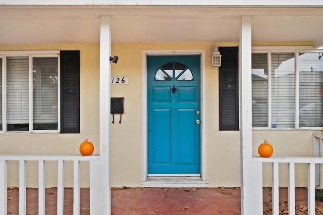 entrance to property with covered porch