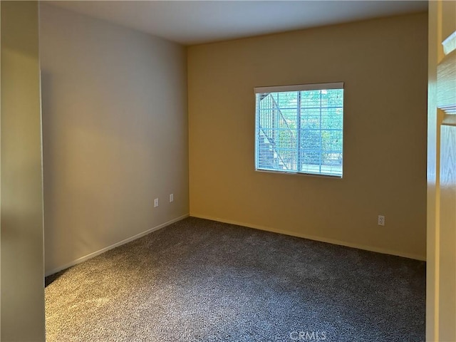 unfurnished room with carpet floors