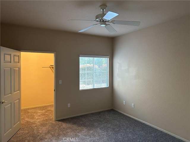 spare room with carpet and ceiling fan