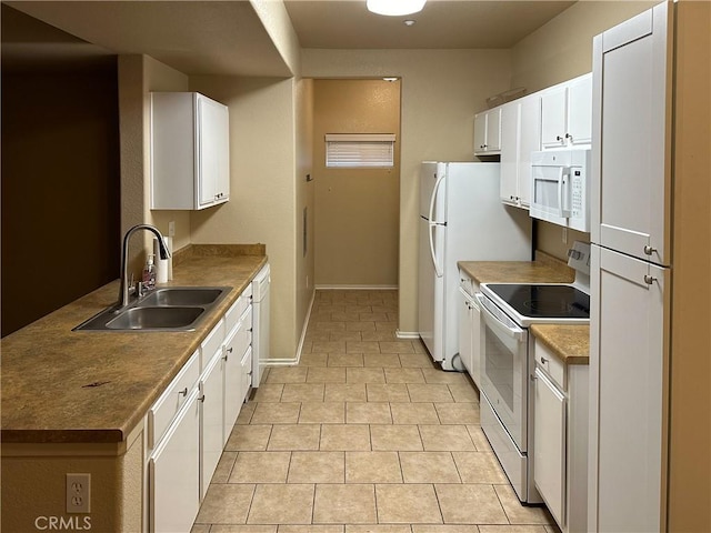 kitchen featuring sink, white cabinets, white appliances, and light tile patterned floors