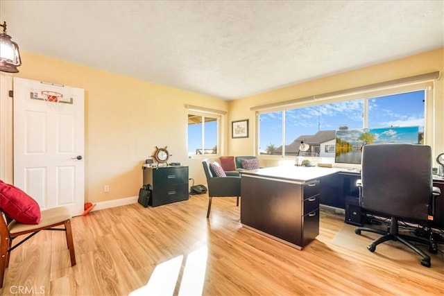 office space with light wood-type flooring