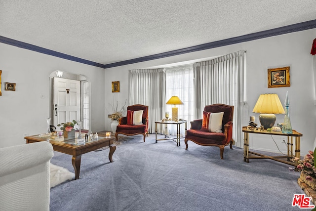 living room featuring crown molding, carpet floors, and a textured ceiling