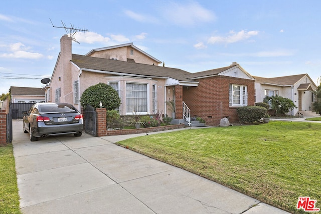 view of front facade featuring a front yard