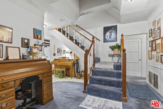 interior space featuring a textured ceiling