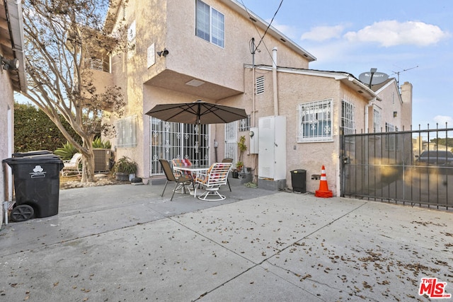 rear view of property featuring a patio