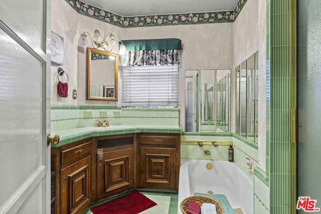 bathroom with a washtub and vanity