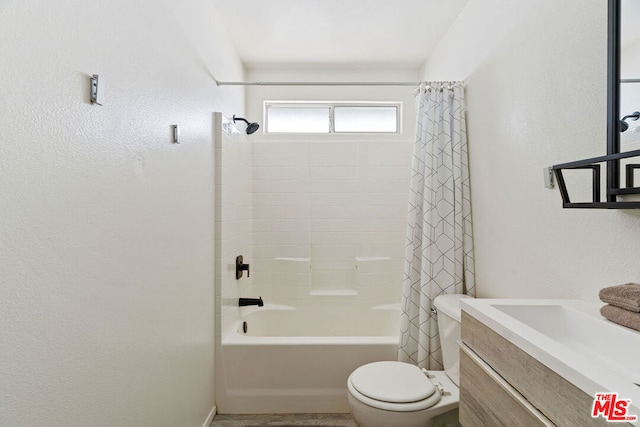 full bathroom featuring vanity, shower / bath combination with curtain, and toilet