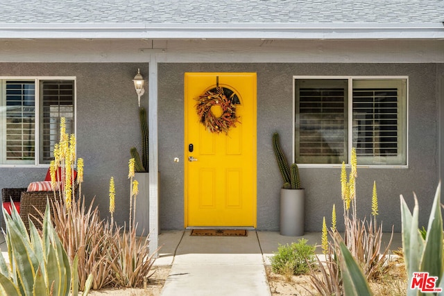 doorway to property featuring covered porch