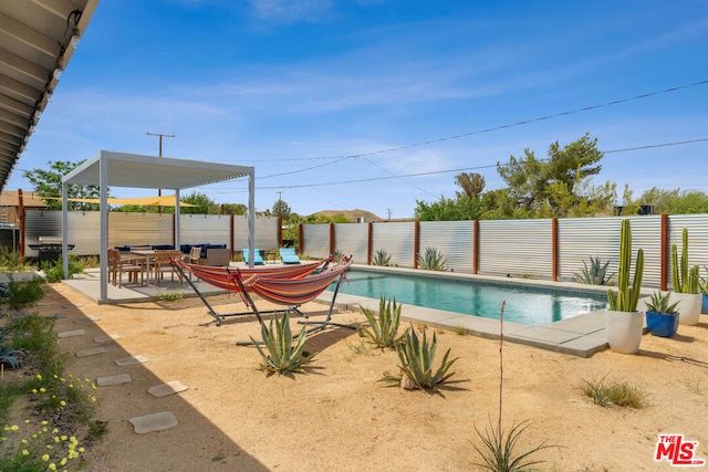 view of swimming pool featuring a patio area