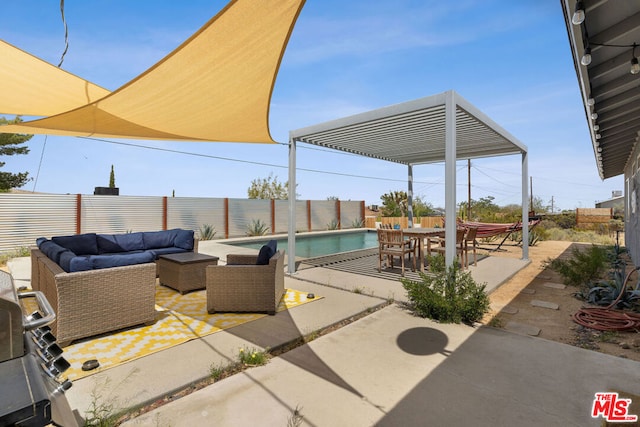 view of patio / terrace with an outdoor living space and a fenced in pool