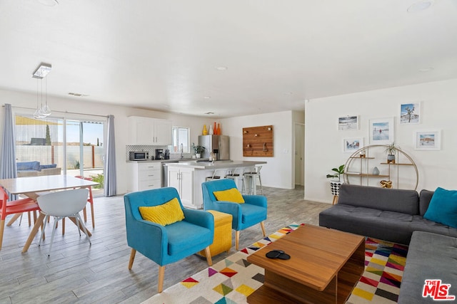 living room featuring light wood-type flooring