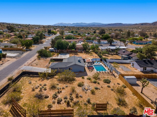 drone / aerial view featuring a mountain view