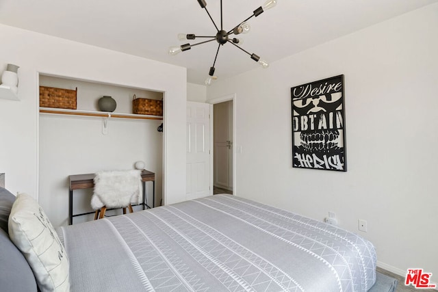 bedroom featuring carpet and an inviting chandelier