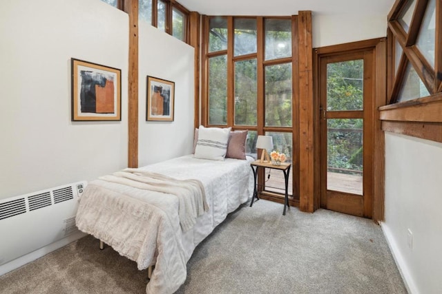 carpeted bedroom with radiator