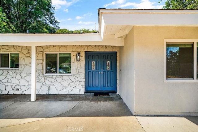 entrance to property with a porch